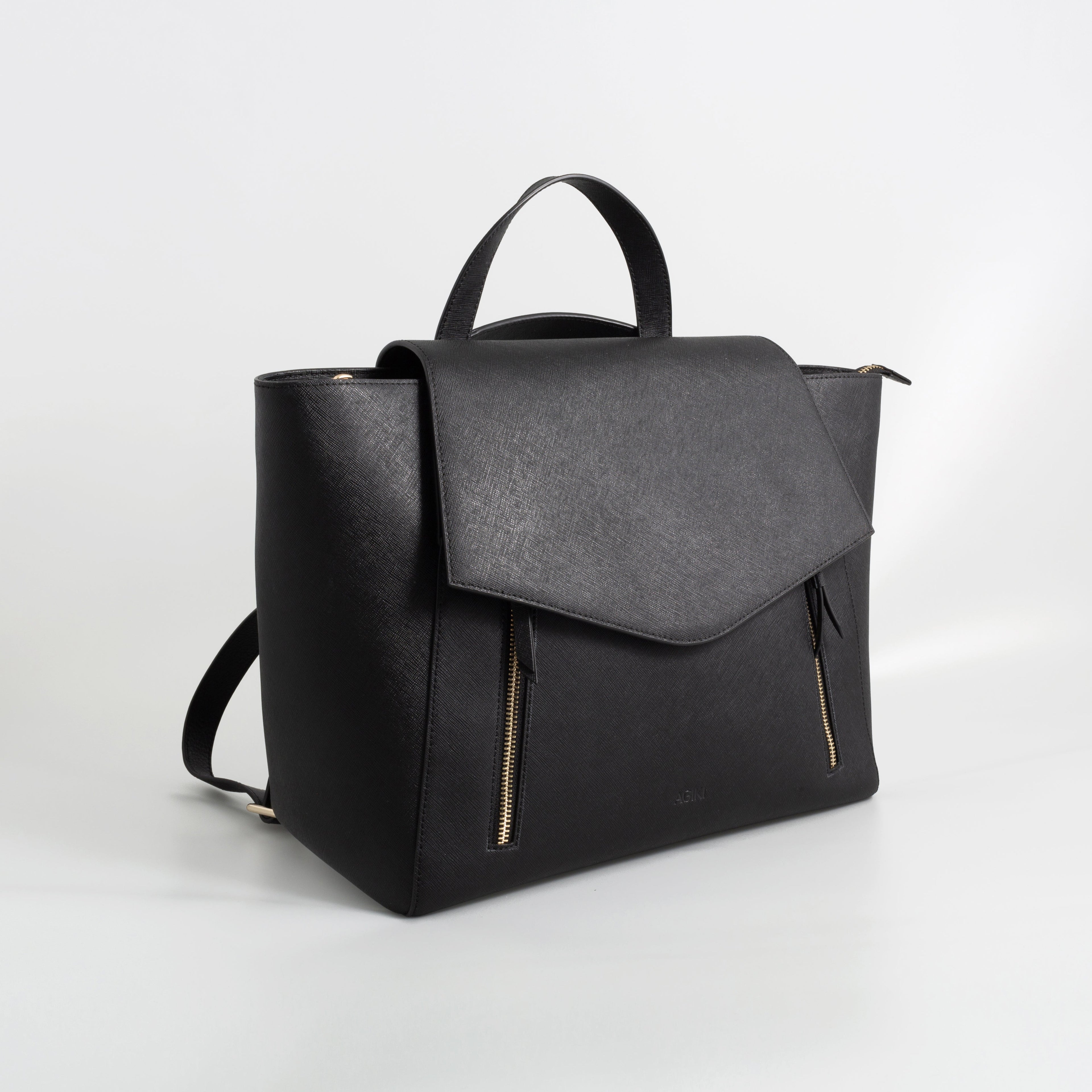 AGIKI Classic Black convertible genuine leather laptop work bag for women with adjustable strap, shown in backpack mode